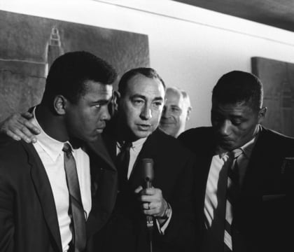 Muhammad Ali and Howard Cosell with a microphone