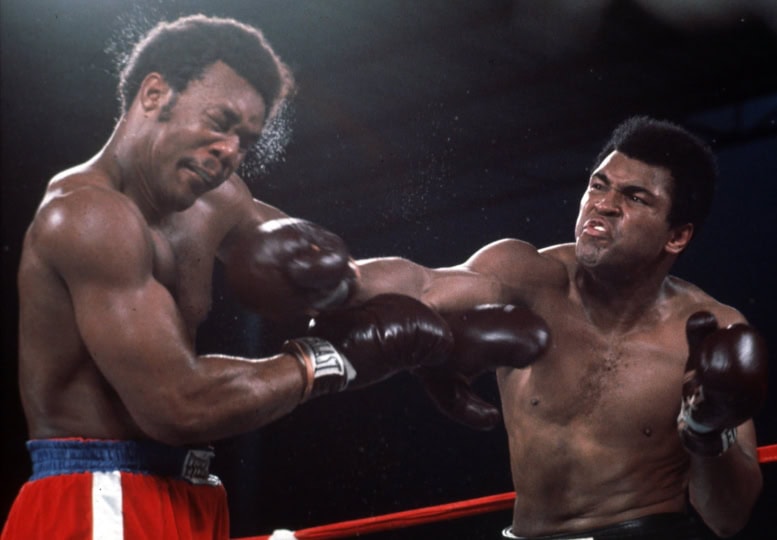 Muhammad Ali landing a right punch on George Foreman during their 1974 “Rumble in the Jungle” boxing match in Kinshasa, Zaire.