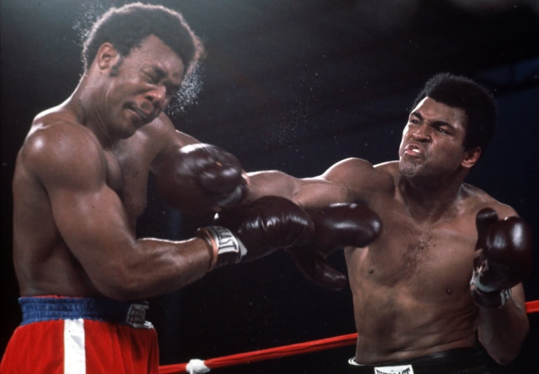 Muhammad Ali landing a right punch on George Foreman during their 1974 “Rumble in the Jungle” boxing match in Kinshasa, Zaire.