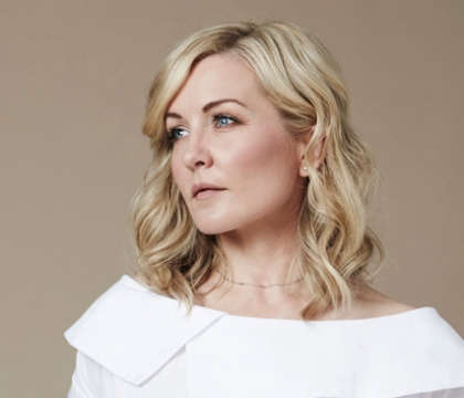Woman wearing white blouse looking off camera