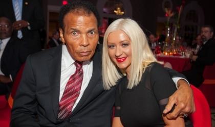 Muhammad Ali posing with Christina Aguilera