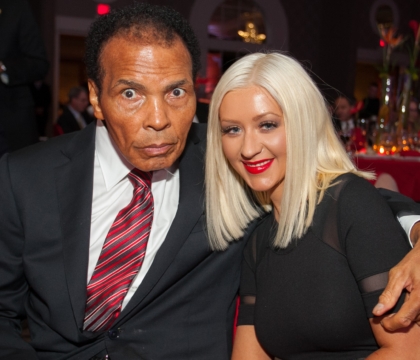 Muhammad Ali posing with Christina Aguilera