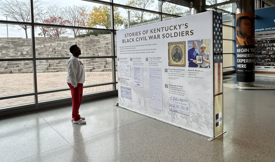 Man looking at signage in lobby highlighting Civil War history
