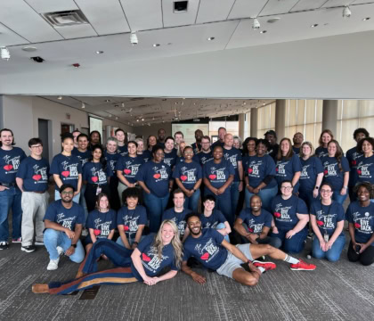 Photo of Muhammad Ali Center and Metro United Way crew in blue shirts posing for picture