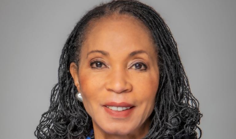 Portrait photo of a woman in blue business attire