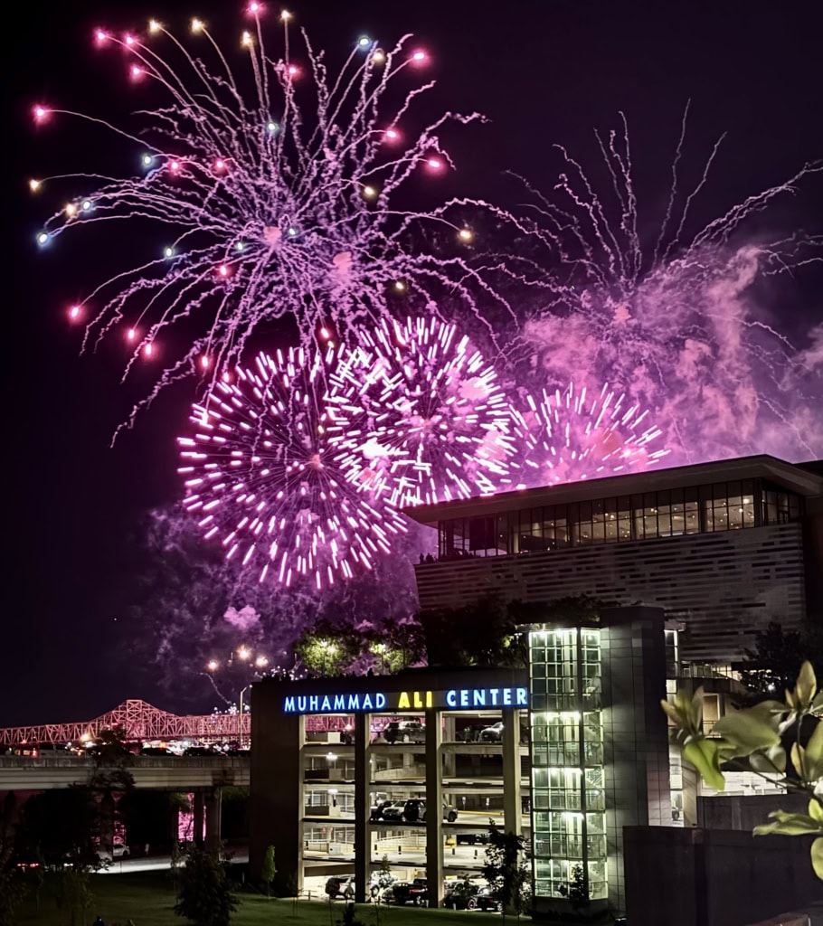 Muhammad Ali Center building with purple fireworks in background