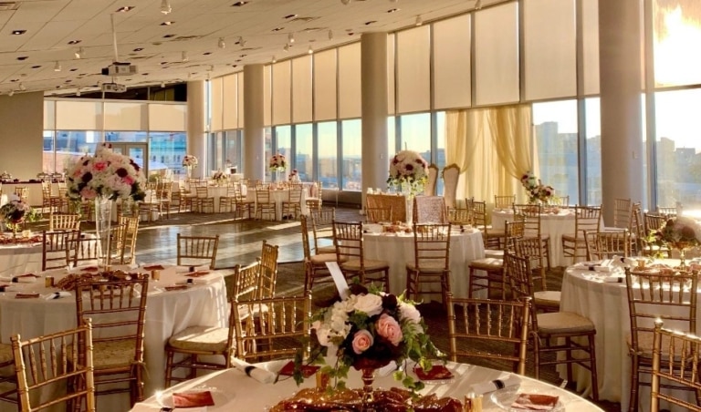 View of View Pointe Hall set up for a wedding with large round tables and chairs