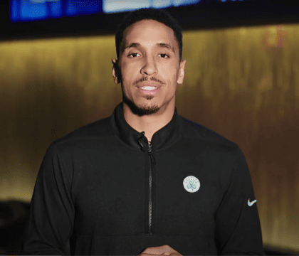 Man standing in a black zip-up jacket